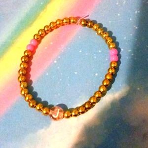 Gold and pink j letter bracelet size:very small-xxlrge just say what size you wa